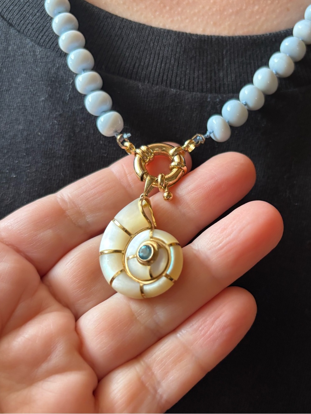 Gorgeous 14KT Mother Of Pearl Nautilus Pendant With Blue Topaz